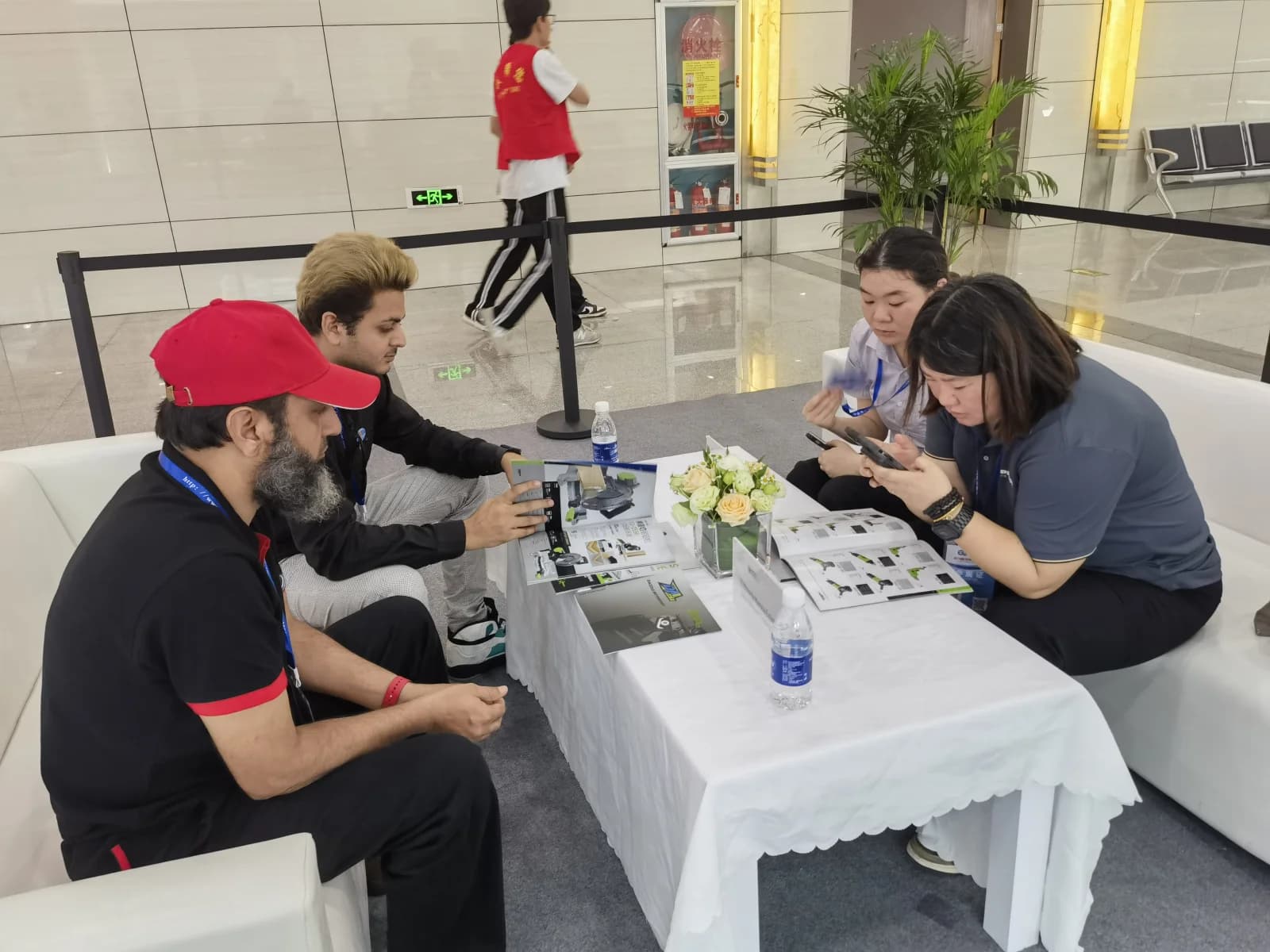 Supplier verification meeting with product catalogs at a trade exhibition in China